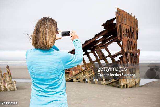 Female Captures Picture With Iphone, Stock-Foto