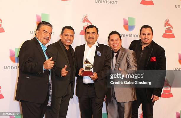 The band Conjunto Primavera, winner of Best Norteno Album, pose in the press room during the 15th annual Latin GRAMMY Awards at the MGM Grand Garden...