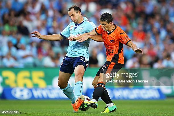 Liam Miller of the Roar competes with Richard Garcia of Sydney during the round 12 A-League match between Sydney FC and Brisbane Roar at Allianz...
