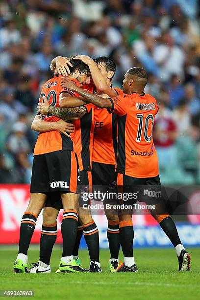 Thomas Broich of the Roar celebrates with team mates after scoring during the round 12 A-League match between Sydney FC and Brisbane Roar at Allianz...