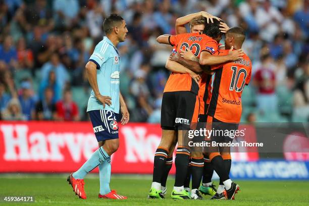 Thomas Broich of the Roar celebrates with team mates after scoring during the round 12 A-League match between Sydney FC and Brisbane Roar at Allianz...