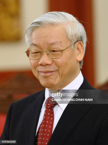 Vietnam Communist Party Secretary General Nguyen Phu Trong smiles as he waits for the arrival of the visiting Cambodian Prime Minister Hun Sen in...