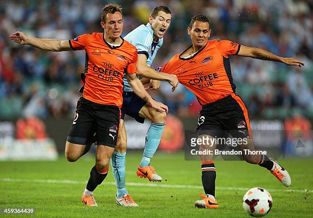 Brett Emerton of Sydney competes with Matthew Smith and Jade North of the Roar during the round 12 A-League match between Sydney FC and Brisbane Roar...