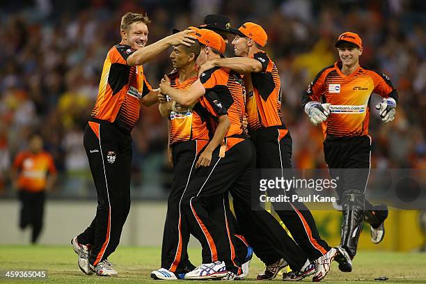 Alfonso Thomas of the Scorchers is congratulated by team mates after winning the Big Bash League match between the Perth Scorchers and the Melbourne...