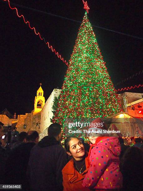 Christian worshippers celebrate outside the Church of the Nativity on December 24, 2013 in Bethlehem, West Bank. Every Christmas pilgrims travel to...