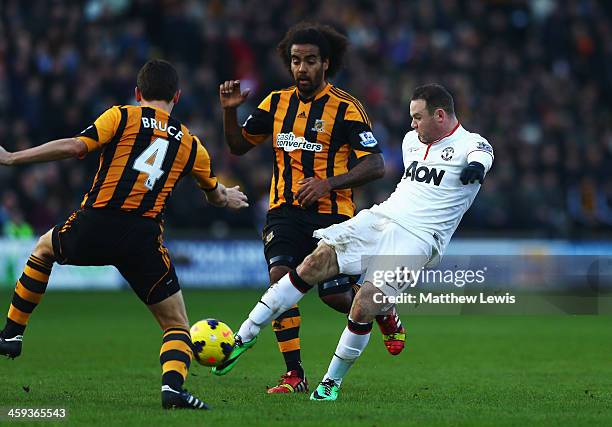 Wayne Rooney of Manchester United shoots and scores his sides second goal during the Barclays Premier League match between Hull City and Manchester...