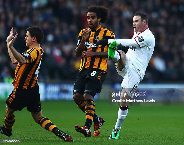 Wayne Rooney of Manchester United shoots and scores his sides second goal during the Barclays Premier League match between Hull City and Manchester...