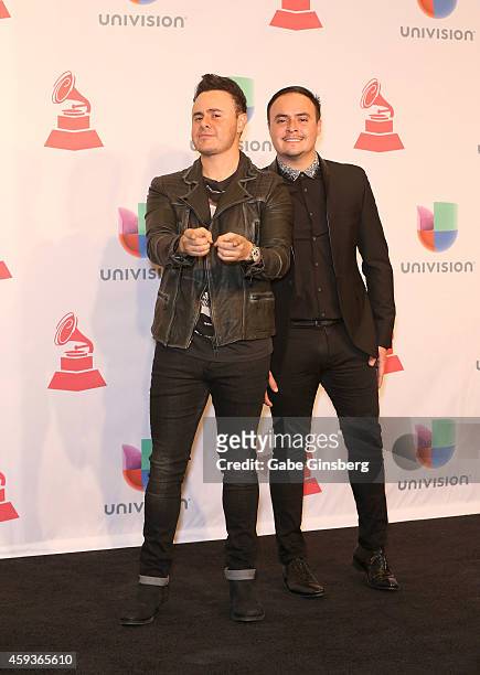 Musicians Jose Luis Ortega and Raul Ortega of Rio Roma pose iin the press room during the 15th annual Latin GRAMMY Awards at the MGM Grand Garden...