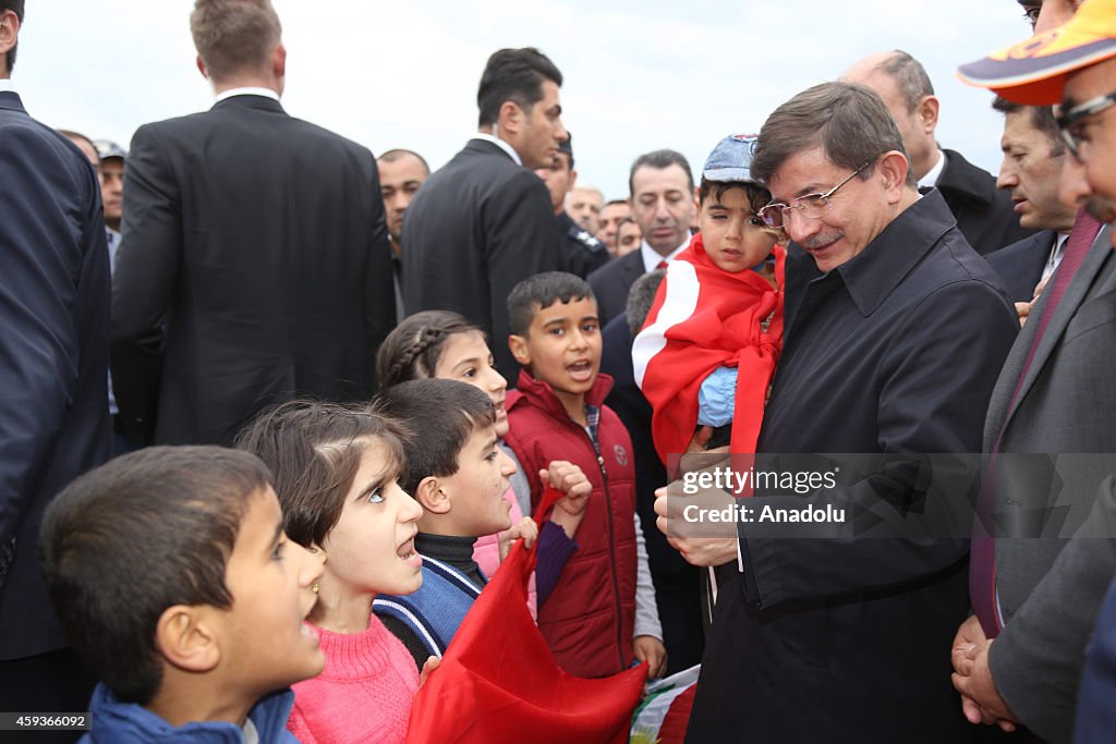 Turkish PM Davutoglu visits the Yazidi refugee camp in Iraq's Dohuk