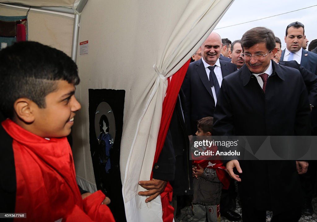 Turkish PM Davutoglu visits the Yazidi refugee camp in Iraq's Dohuk