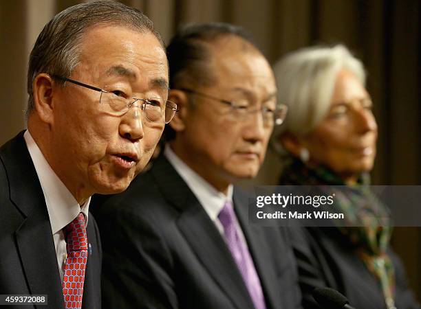 Ban Ki-moon , Secretary General, United Nations speaks while flanked by Jim Yong Kim World Bank President, and Christine Lagarde, IMF Managing...