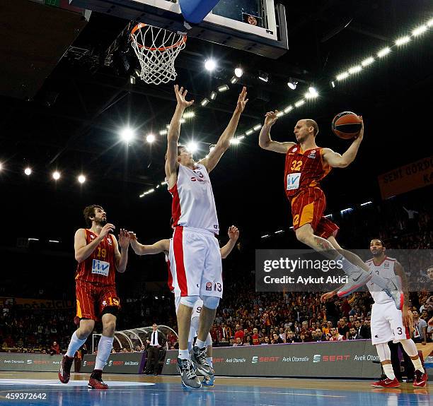 Sinan Guler, #32 of Galatasaray Liv Hospital Istanbul competes with Boban Marjanovic, #13 of Crvena Zvezda Telekom Belgrade during the 2014-2015...