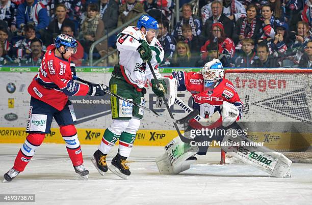 Jimmy Sharrow, Ivan Ciernik of the Augsburger Panther and Petri Vehanen of the Eisbaeren Berlin in action during the game between Eisbaeren Berlin...