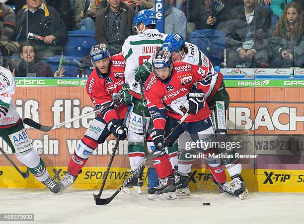 Barry Tallackson, Sebastian Uvira, Sven Ziegler and Daniel Weiss of the Augsburger Panther in action during the game between Eisbaeren Berlin and...