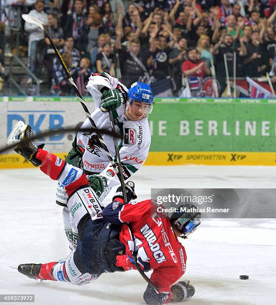 Daniel Weiss of the Augsburger Panther and T.J. Mulock of the Eisbaeren Berlin in action during the game between Eisbaeren Berlin and Augsburger...