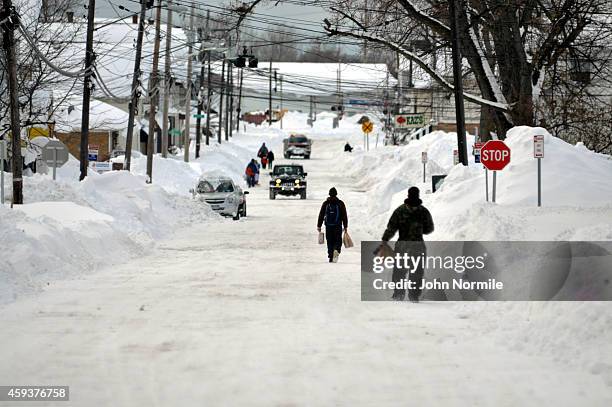 Residents take to the street for supplies along Lake Avenue on November 20, 2014 in the suburb of Blasdell, Buffalo, New York. The record setting...