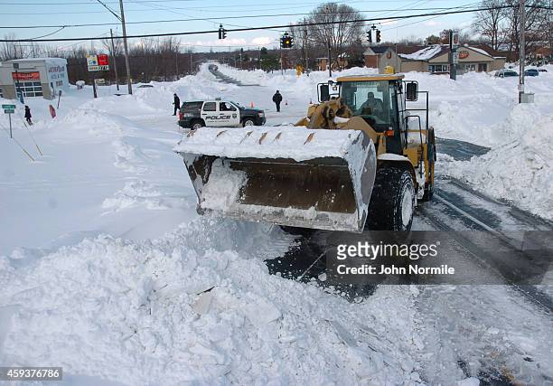 High loader works to clear snow along McKinley Park Avenue on November 20, 2014 in the suburb of Blasdell, Buffalo, New York. The record setting Lake...