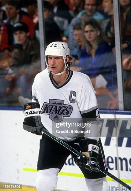 Wayne Gretzky of the Los Angeles Kings skates on the ice during an NHL game circa 1991 at the Great Western Forum in Inglewood, California.