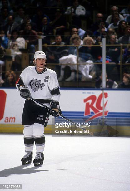 Wayne Gretzky of the Los Angeles Kings skates on the ice during an NHL game circa 1991 at the Great Western Forum in Inglewood, California.