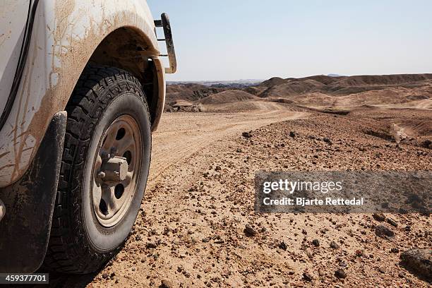 offroad truck wheel on dirt road - off highway vehicle stock pictures, royalty-free photos & images