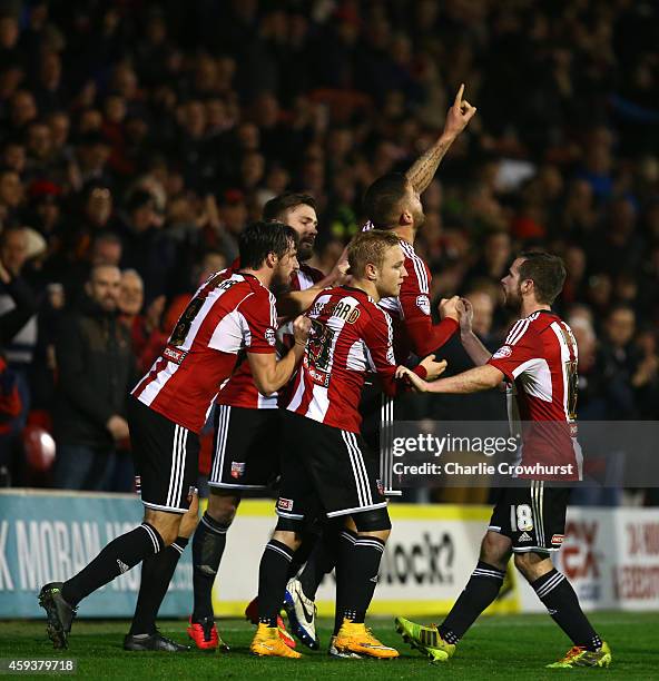 Harlee Dean of Brentford celebrates with team mates after scoring the teams first goal and the equaliser during the Sky Bet Championship match...