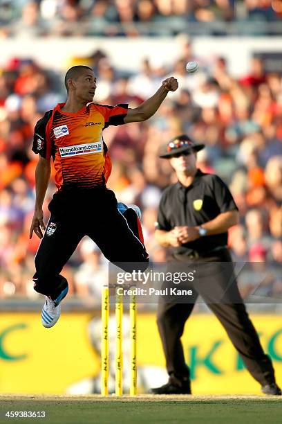 Alfonso Thomas of the Scorchers attempts to catch the ball of his bowling during the Big Bash League match between the Perth Scorchers and the...