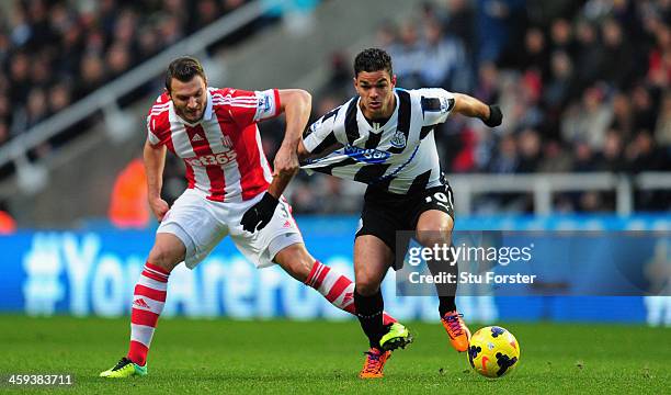 Newcastle player Hatem Ben Arfa tangles with Erik Peters during the Barclays Premier League match between Newcastle United and Stoke City at St...