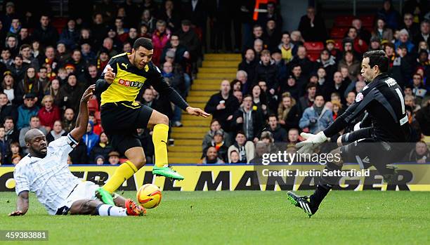 Danny Shittu of Millwall fouls Troy Deeney of Watford which resulted in him being sent off and lead to a penalty which was scored by Troy Deeney of...