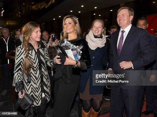 Queen Maxima of The Netherlands and King Willem-Alexander of The Netherlands pose with royalty fans who gave them chololate while leaving the...