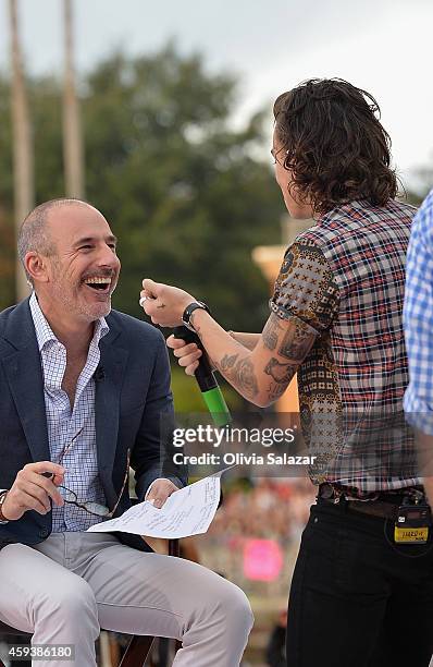 Matt Lauer and Harry Styles appear on NBC's Today Show to release their new album "Four" at Universal City Walk At Universal Orlando on November 17,...