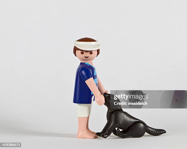 playmobil couple, man with dog - playmobil stock pictures, royalty-free photos & images