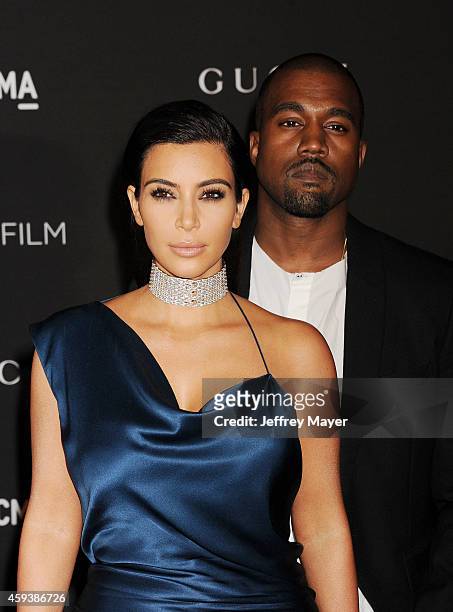 Personality Kim Kardashian and recording artist Kanye West attend the 2014 LACMA Art + Film Gala honoring Barbara Kruger and Quentin Tarantino...