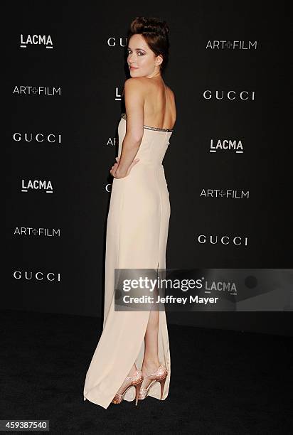 Actress Dakota Johnson attends the 2014 LACMA Art + Film Gala honoring Barbara Kruger and Quentin Tarantino presented by Gucci at LACMA on November...