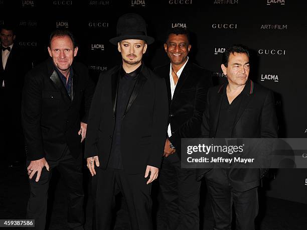 Musicians Roy Hay, Boy George, wearing Gucci, Mikey Craig and Jon Moss of Culture Club attend the 2014 LACMA Art + Film Gala honoring Barbara Kruger...