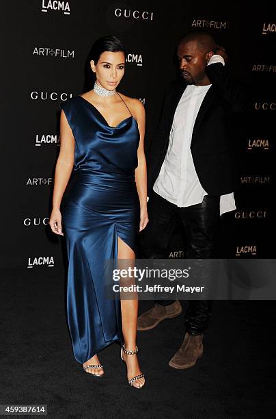 Personality Kim Kardashian and recording artist Kanye West attend the 2014 LACMA Art + Film Gala honoring Barbara Kruger and Quentin Tarantino...
