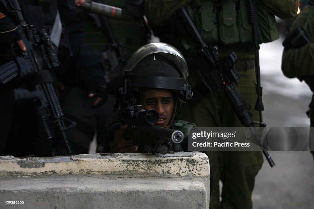 Israeli border policemen take up position during  the clash...