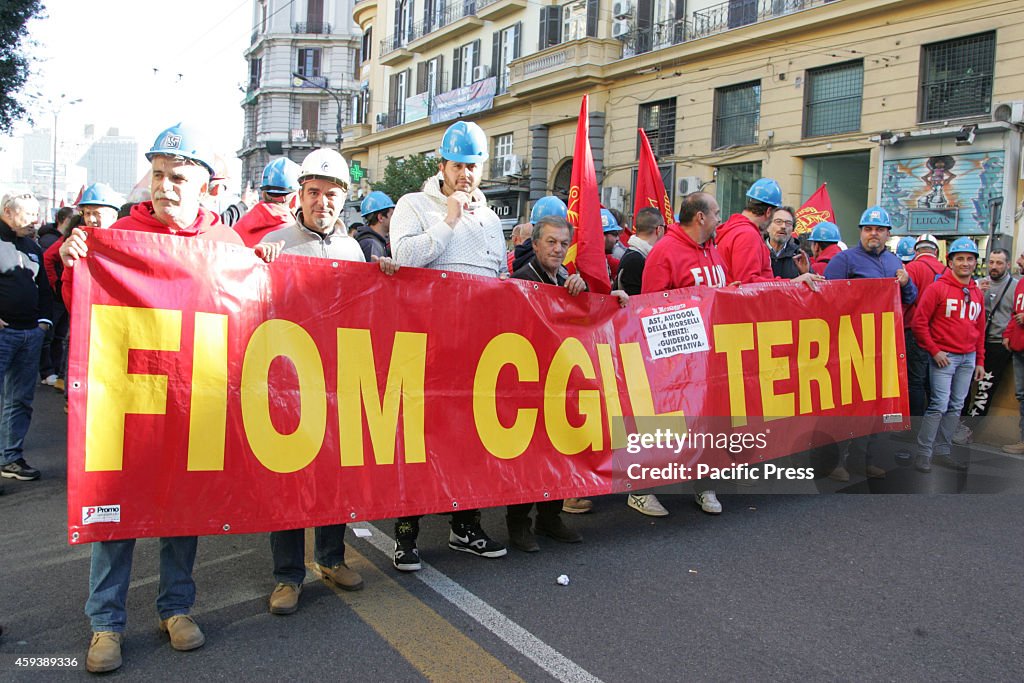 Metal workers from Fiom CGIL bring banners and shout slogans...