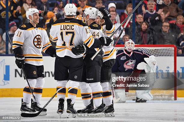 The Boston Bruins celebrate after scoring a goal during the third period of a game against the Columbus Blue Jackets on November 21, 2014 at...