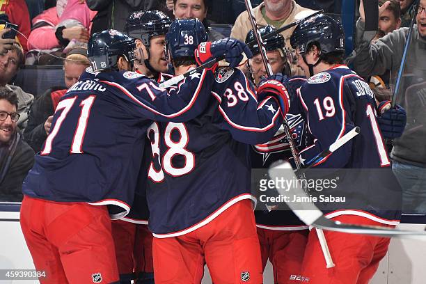 The Columbus Blue Jackets celebrate after scoring a goal during the third period of a game against the Boston Bruins on November 21, 2014 at...