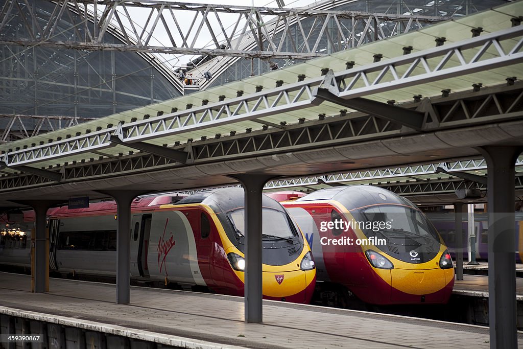 Railway station with Virgin Pendolino trains