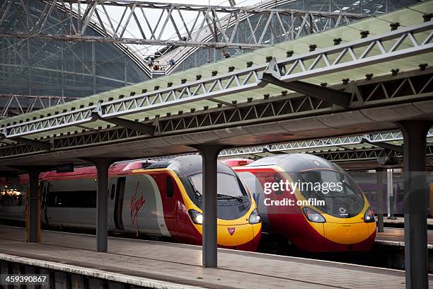 railway station with virgin pendolino trains - piccadilly stock pictures, royalty-free photos & images