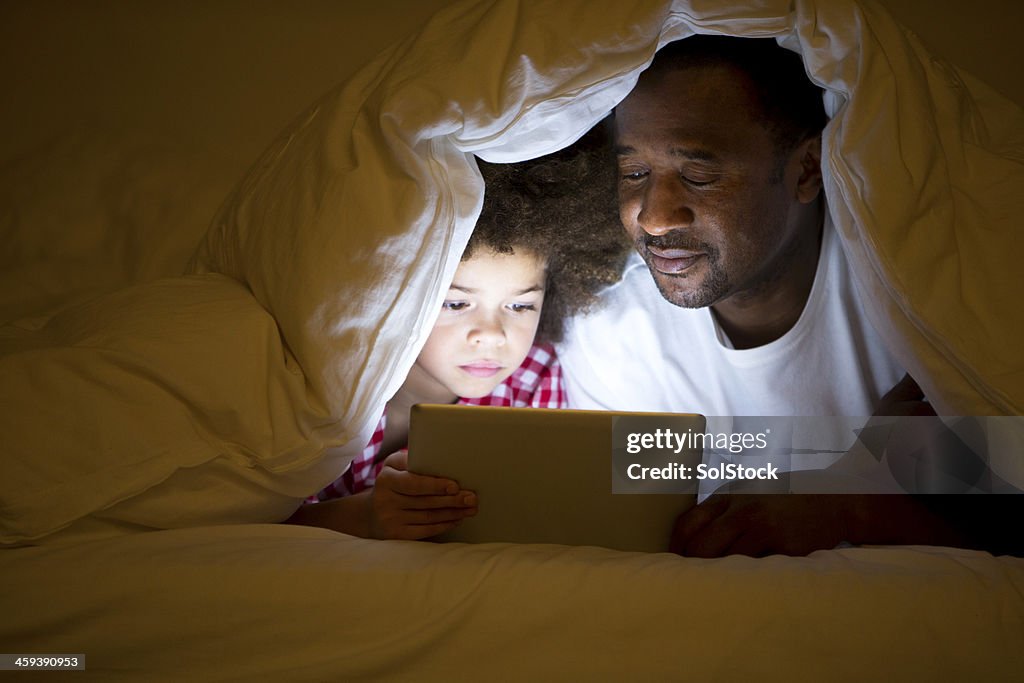 Grandfather and Grandson lying in bed