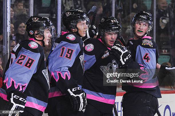 Adam Tambellini of the Calgary Hitmen celebrates after scoring a goal against the Moose Jaw Warriors during a WHL game at Scotiabank Saddledome on...