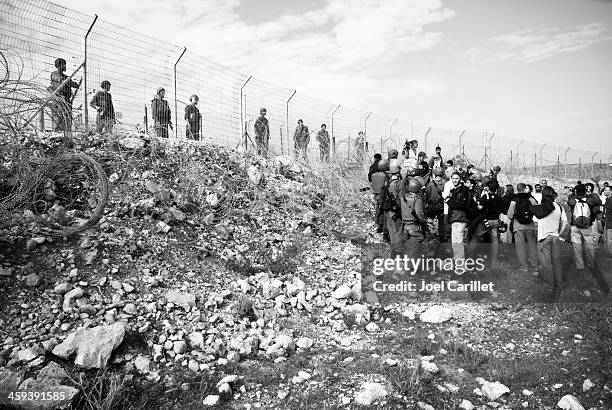 israeli soldiers and demonstrators in the west bank - non violence stock pictures, royalty-free photos & images