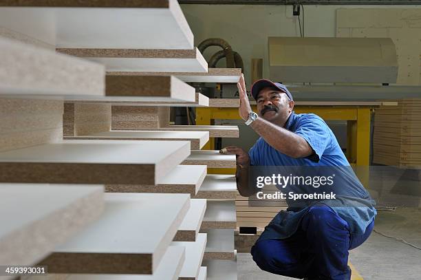 furniture maker inspects desk tops - labor intensive production line stock pictures, royalty-free photos & images