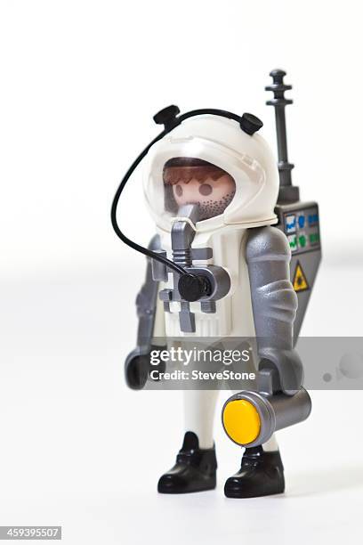 astronaut playmobil child play toy plastic on white background - playmobil stock pictures, royalty-free photos & images