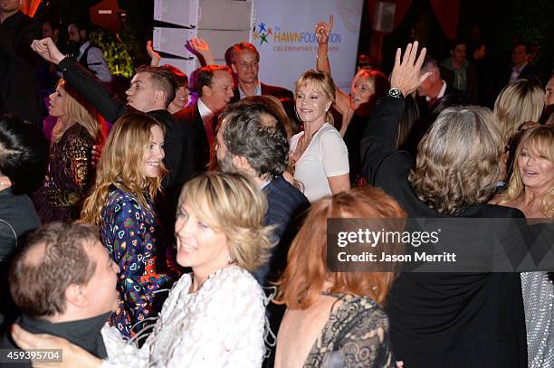 Actresses Leslie Mann and Melanie Griffith dance at Goldie Hawn's inaugural "Love In For Kids" benefiting the Hawn Foundation's MindUp program...