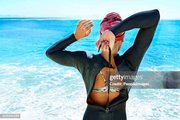 preparing for the open water - wetsuit stock pictures, royalty-free photos & images