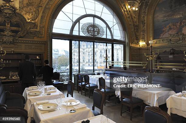 Waiters work in Le Train Bleu restaurant at the Gare de Lyon railway station in Paris on November 21, 2014. Le Train Bleu re-opened after a two-month...