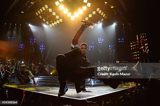 Recording artist Usher performs onstage during "The UR Experience" tour at Staples Center on November 21, 2014 in Los Angeles, California.